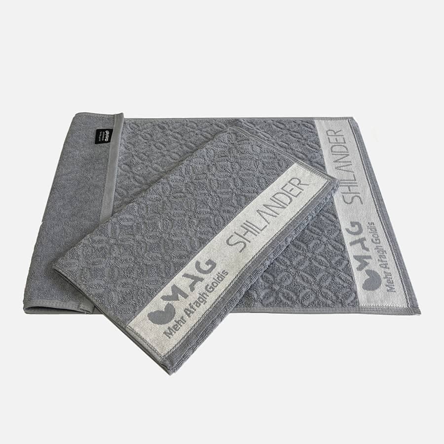 نمونه کار حوله تبلیغاتی شرکت مهرآفاق گلدیس Mehr Afagh Goldis - تکنیک بافت روی متن و بوردر حوله